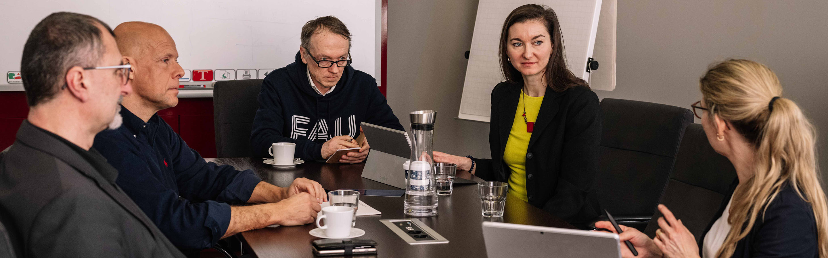 Researchers in a meeting room.